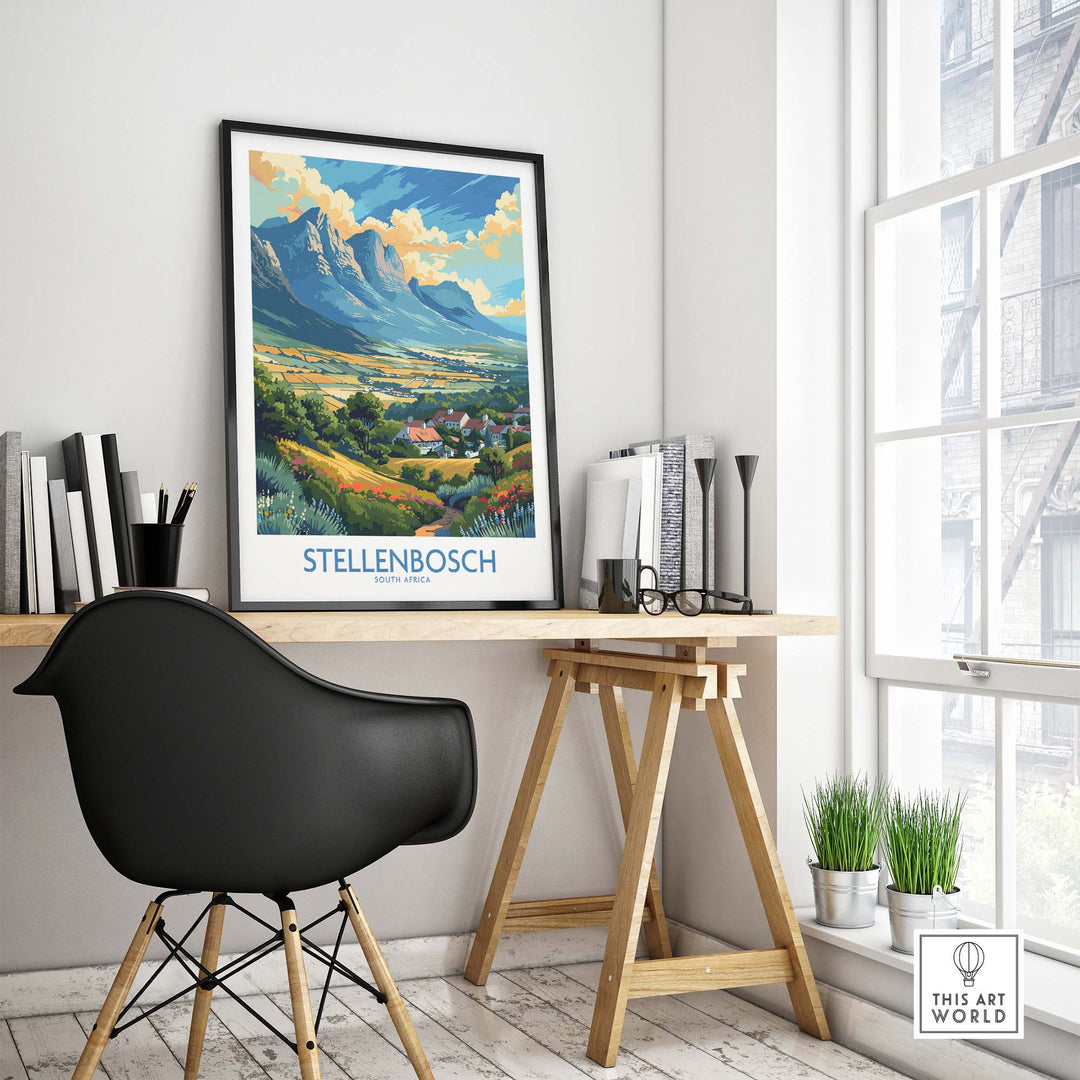 Stellenbosch travel poster displayed in a modern office setting, showcasing South African landscape and vibrant colors.
