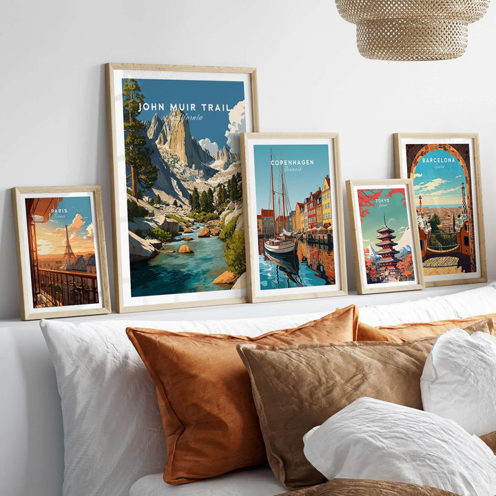 John Muir Trail print with majestic peaks and streams, framed artwork showcased on a stylish bed.