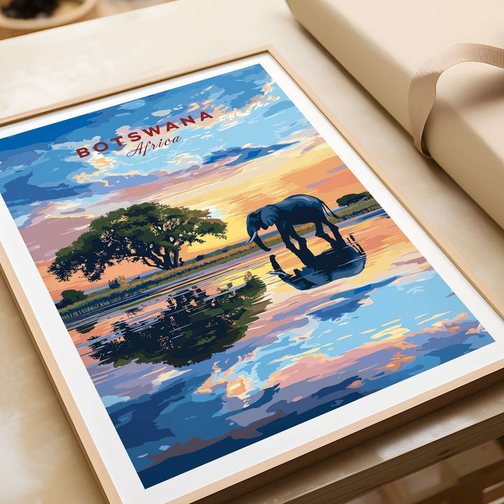 Botswana elephant sunset art print featuring vibrant colors and serene landscape reflection on water.