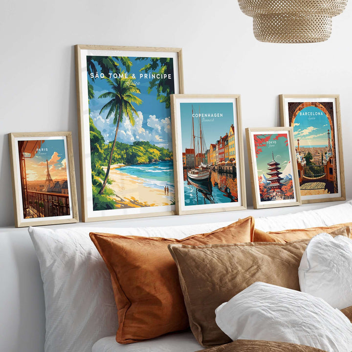 Framed beach and city poster prints, featuring São Tomé & Príncipe, Copenhagen, and Barcelona on a stylish sofa.