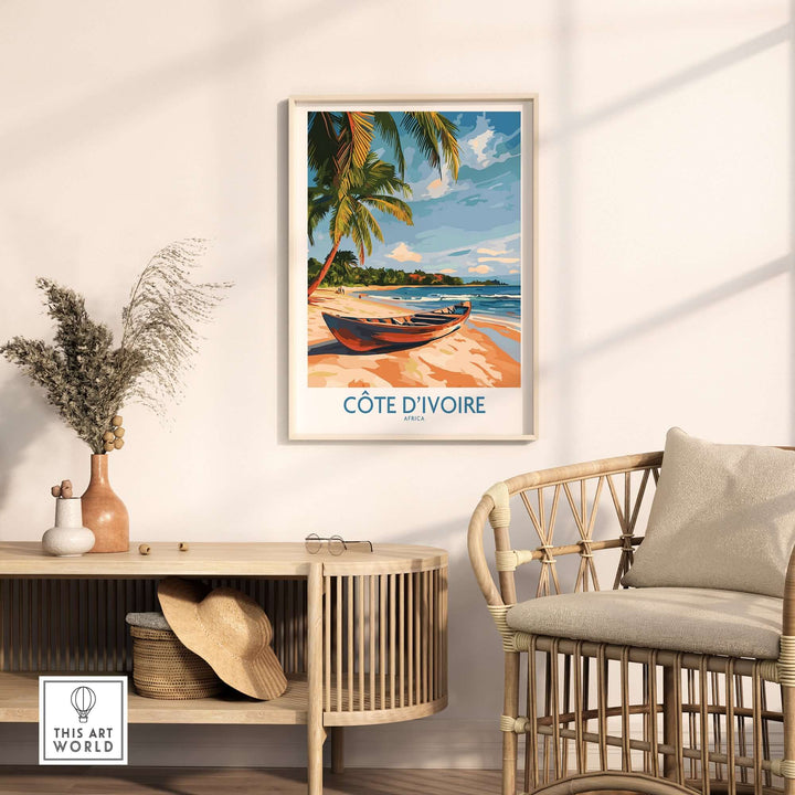 Côte d'Ivoire travel print showcasing a serene beach scene with palm trees and a boat in a stylish interior setting.