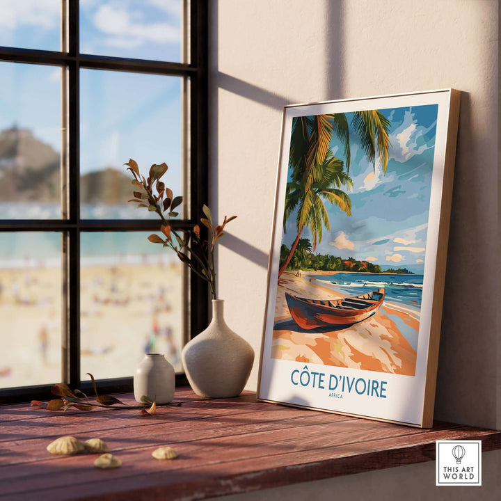 Côte d'Ivoire travel print showcasing a beach scene, displayed in a stylish interior setting.
