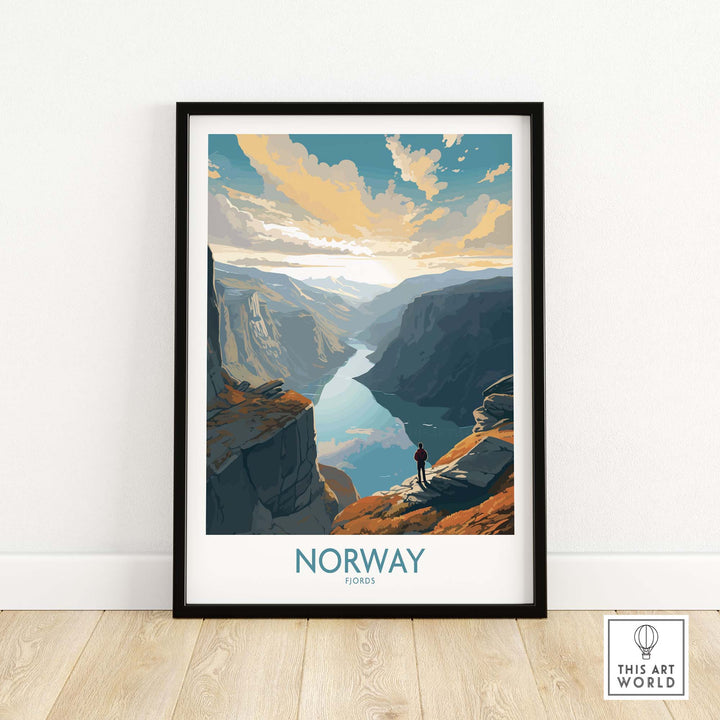 Framed Fjord Wall Art showcasing a stunning Norwegian landscape with a person standing on a cliff, vibrant colors and modern style.