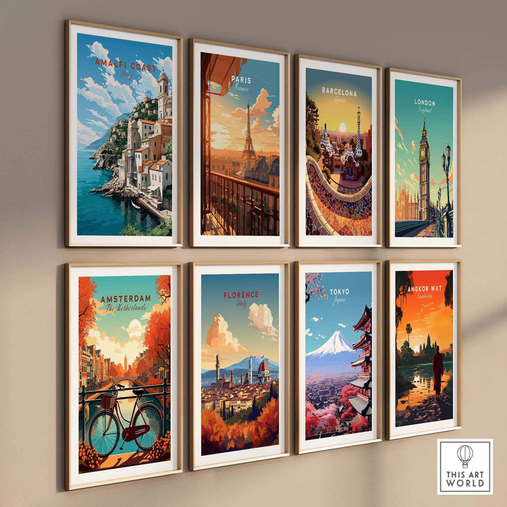 Wall display of travel posters featuring the Amalfi Coast, Paris, Barcelona, London, Amsterdam, Florence, Tokyo, and Angkor Wat.