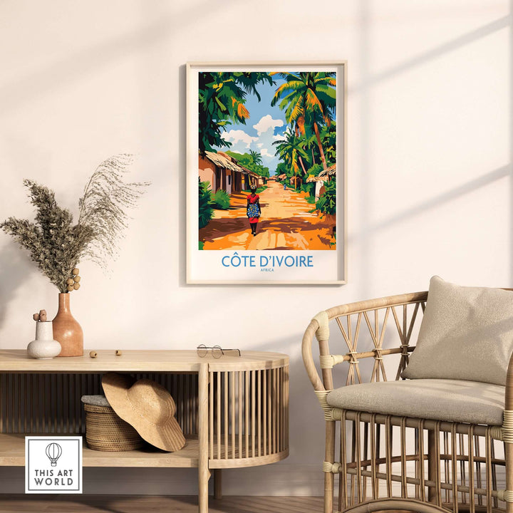 Ivory Coast travel poster featuring vibrant landscape of Cote d'Ivoire with palm trees and local scene on wall decor.