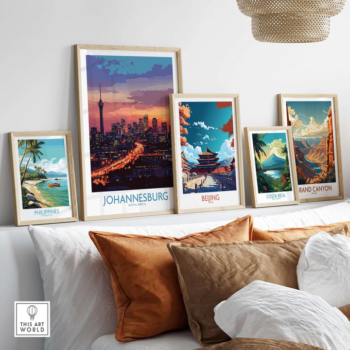 Framed art prints showcasing global landmarks including Johannesburg skyline, Beijing, Costa Rica, and the Grand Canyon.
