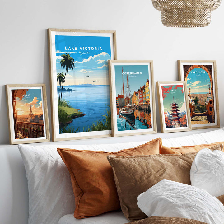 Framed Lake Victoria Uganda travel poster showcased on a gallery wall with other city art prints and cozy decor.