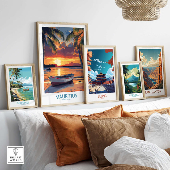 Mauritius travel poster featuring a tropical beach at sunset among framed art pieces on a stylish wall display.
