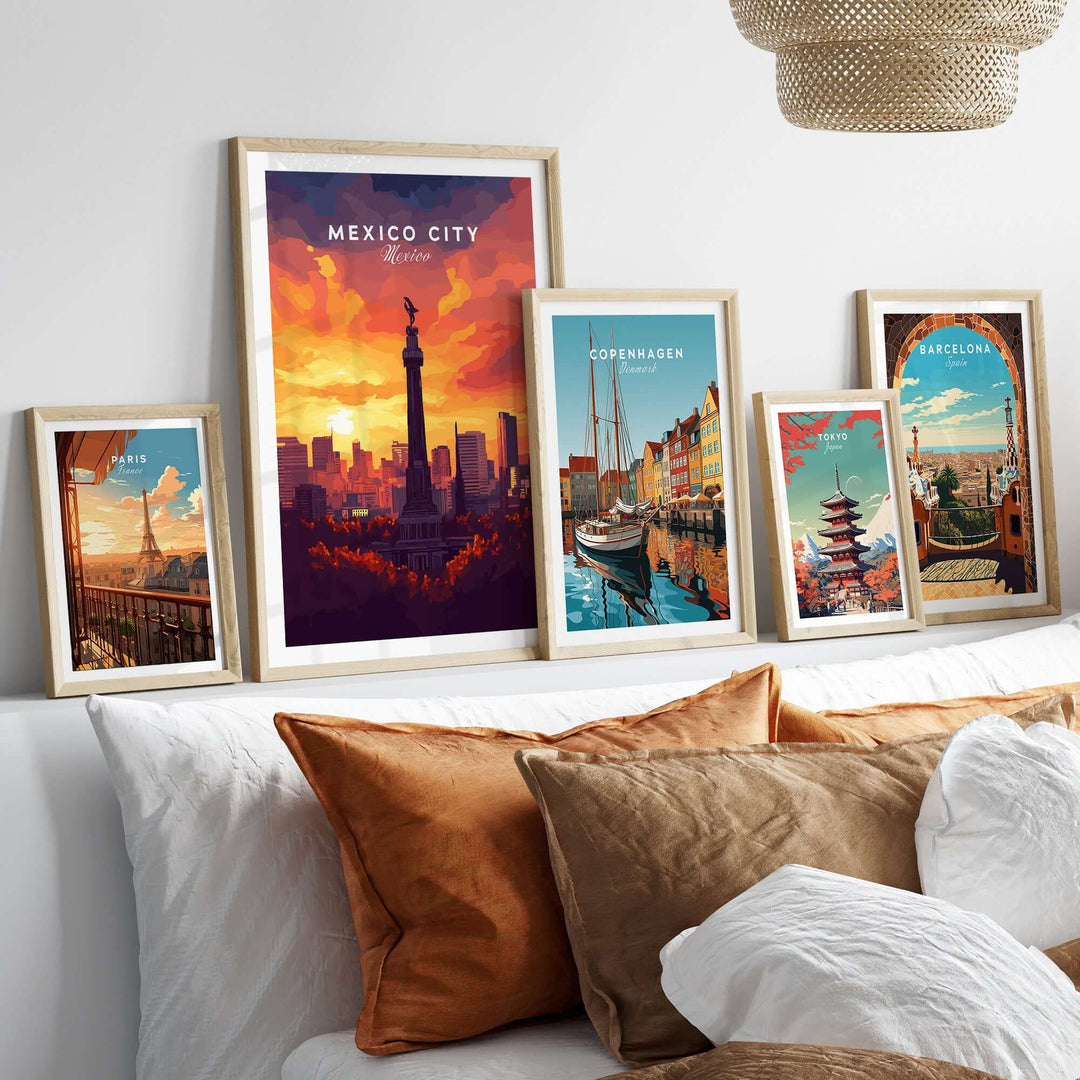 Framed travel prints including Mexico City El Ángel, Copenhagen, and Barcelona displayed on a stylish home decor shelf.