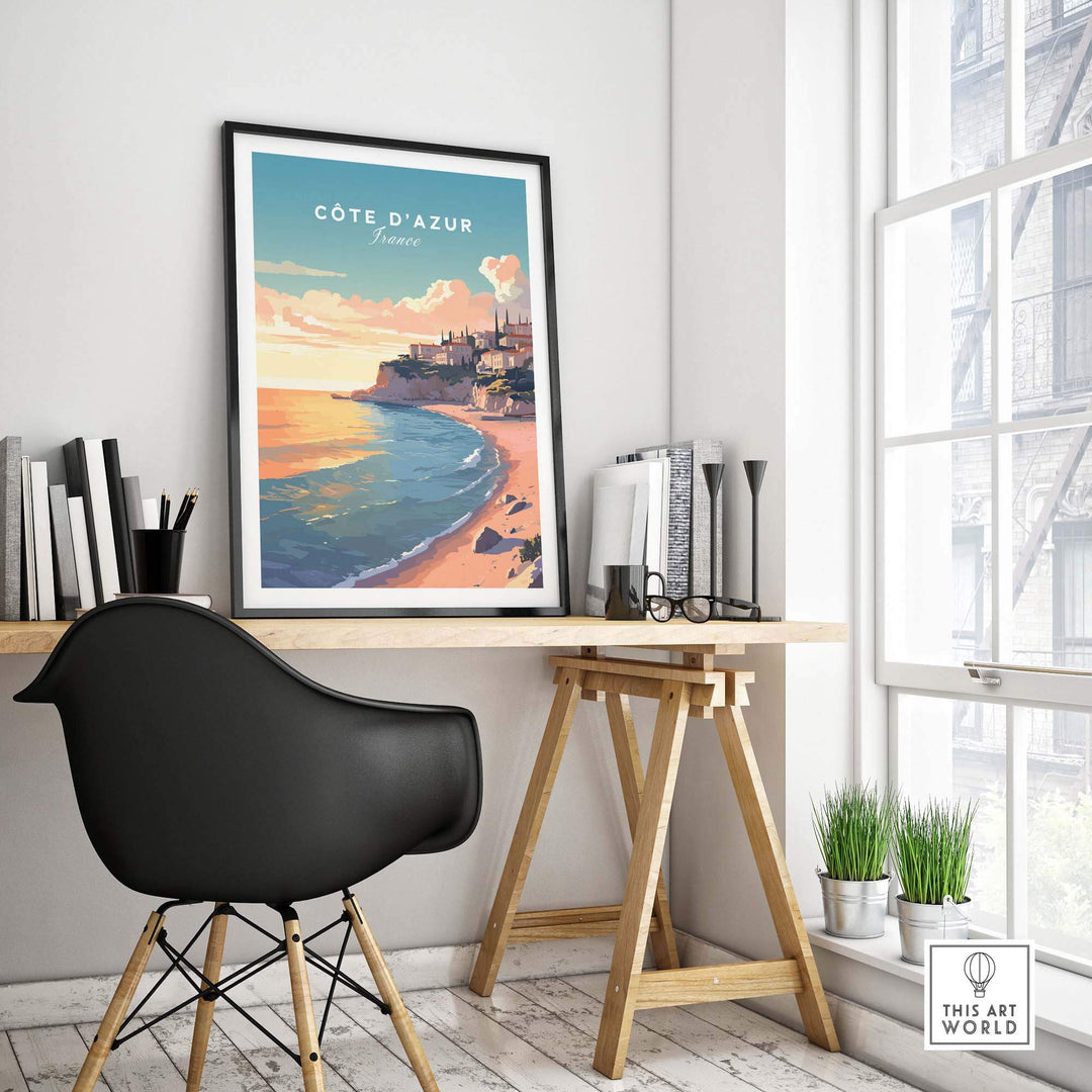 Côte d'Azur travel poster print displayed in modern workspace, capturing vibrant French coast beauty.
