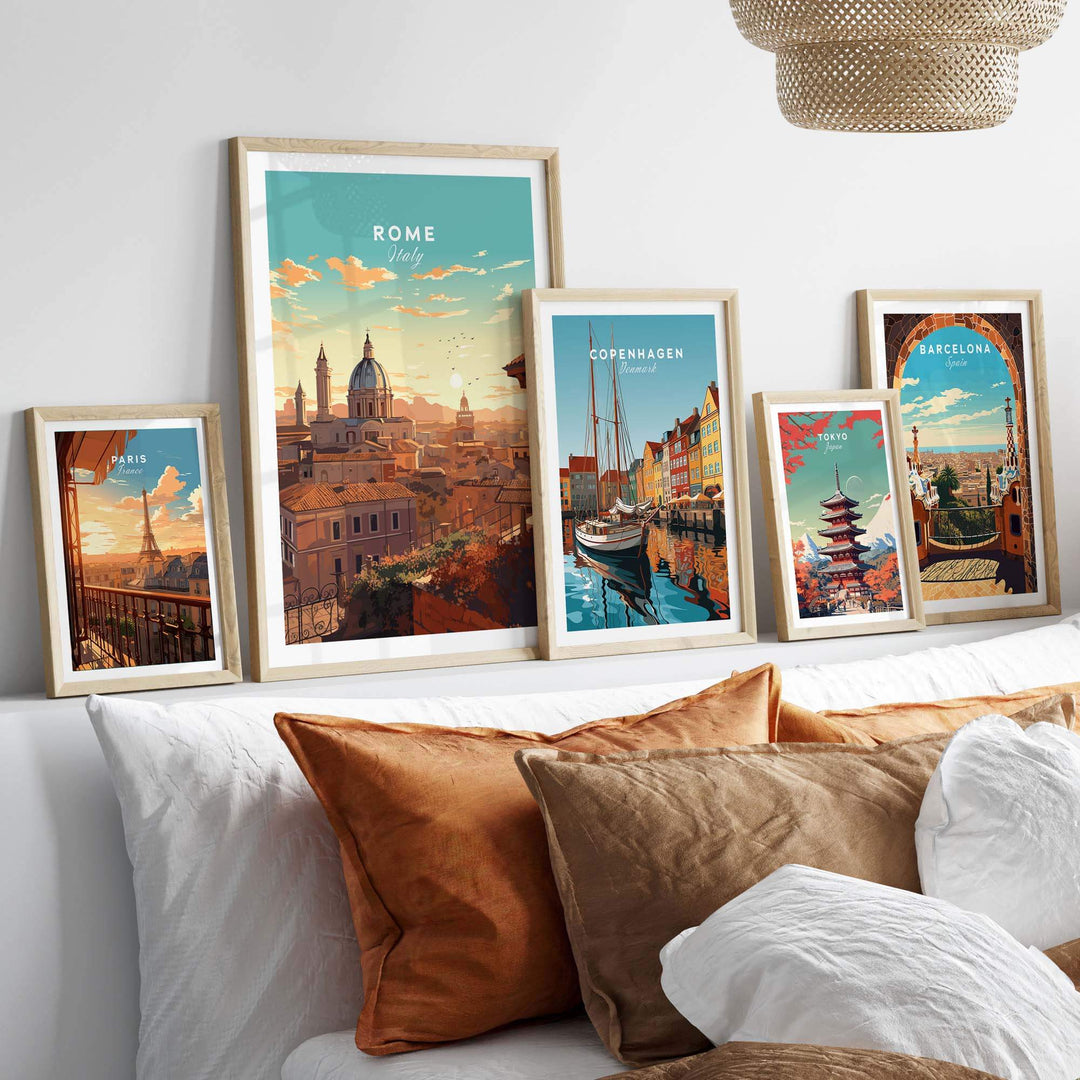Framed Rome print among other city posters on a stylish gallery wall above decorative cushions.