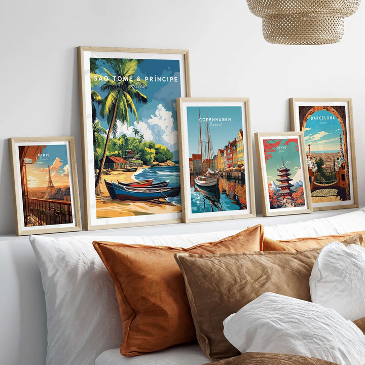 Framed São Tomé and Príncipe poster among other city posters on a stylish bed backdrop, showcasing tropical bliss.