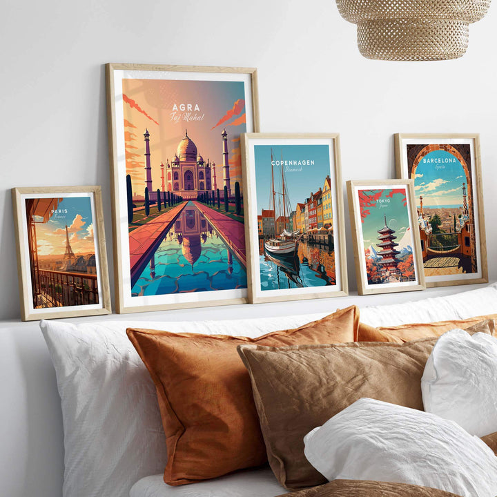 Framed Taj Mahal wall art alongside travel prints of Copenhagen and Barcelona, enhancing home decor with vibrant colors.