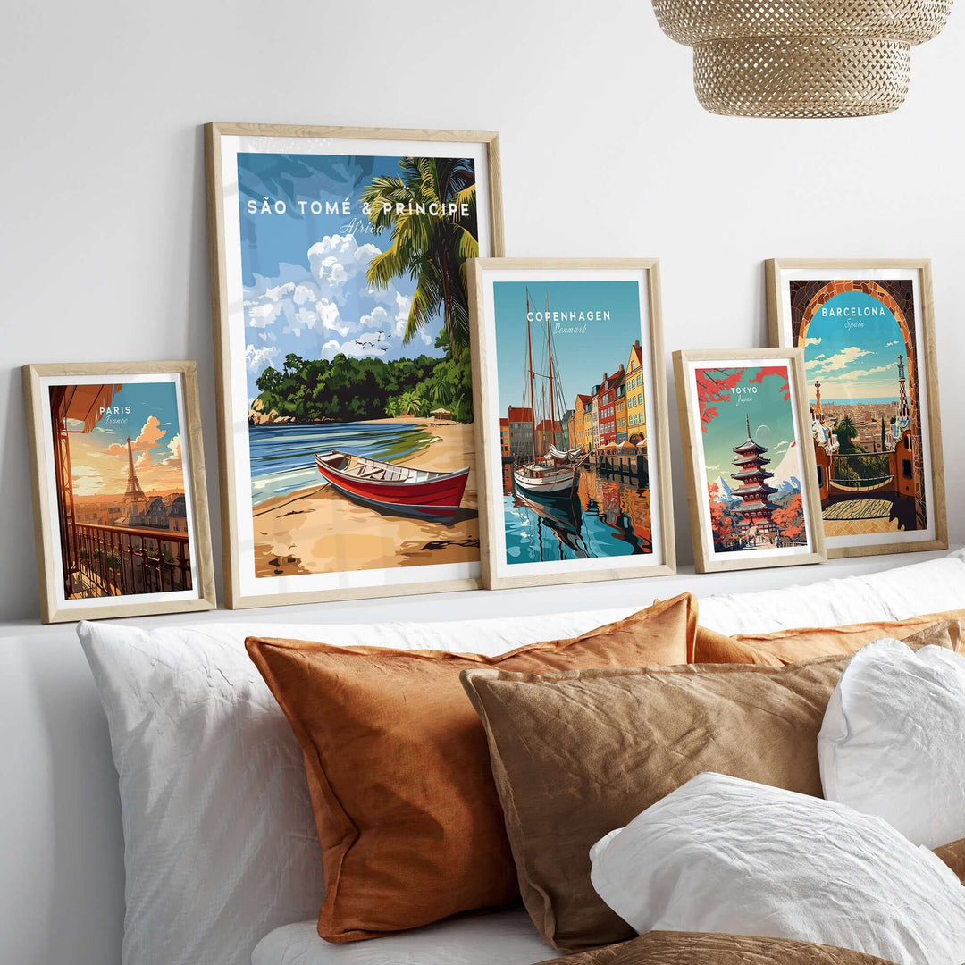 São Tomé & Príncipe wall art featuring tropical scenery and travel-themed prints on a cozy sofa.