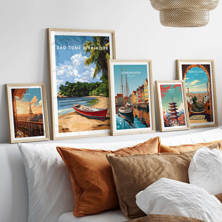 São Tomé & Príncipe wall art featuring tropical scenery and travel-themed prints on a cozy sofa.