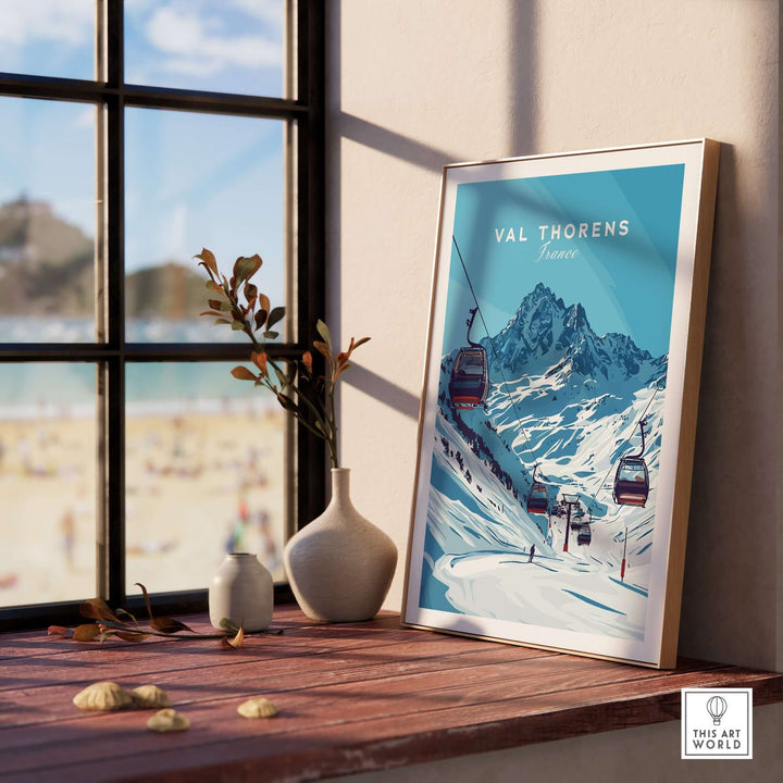 Val Thorens ski art print displayed indoors, showcasing snowy mountains and ski lifts, perfect for winter sports enthusiasts.