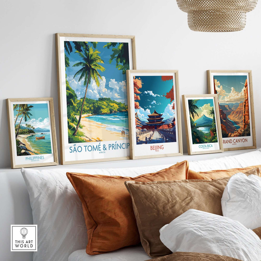Stylish beach travel art prints of São Tomé & Príncipe, Philippines, Beijing, Costa Rica, and the Grand Canyon on a sofa.