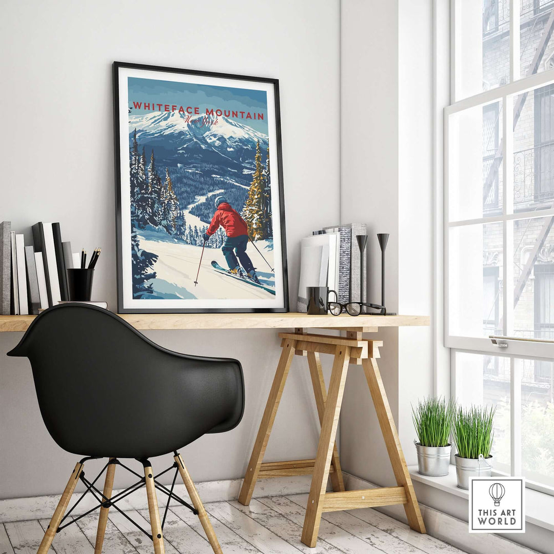 Framed Whiteface Mountain ski poster featuring a skier in a red jacket on a snowy slope in a modern workspace.
