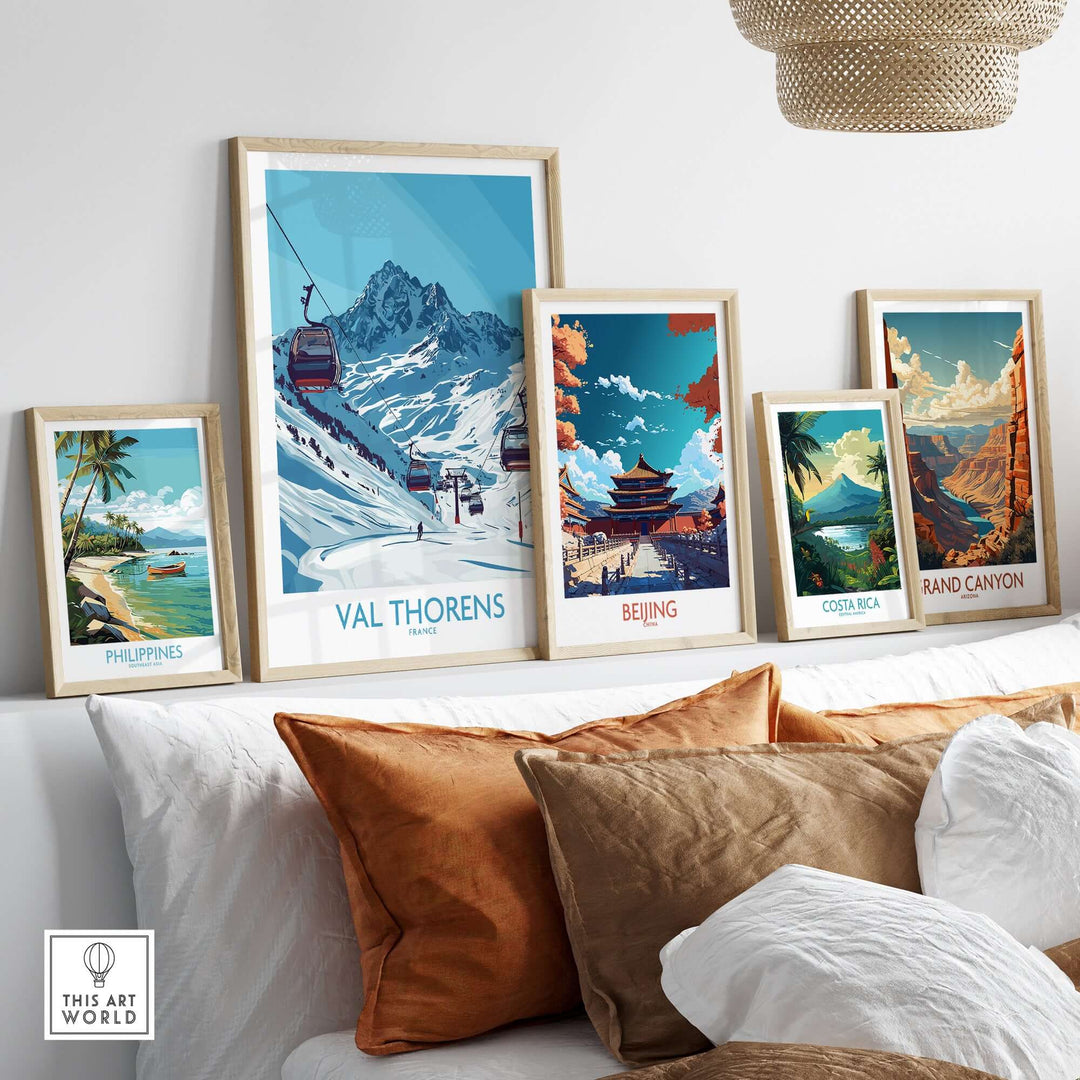 Framed travel posters showcasing Val Thorens, Beijing, Costa Rica, Philippines, and the Grand Canyon in a stylish room.