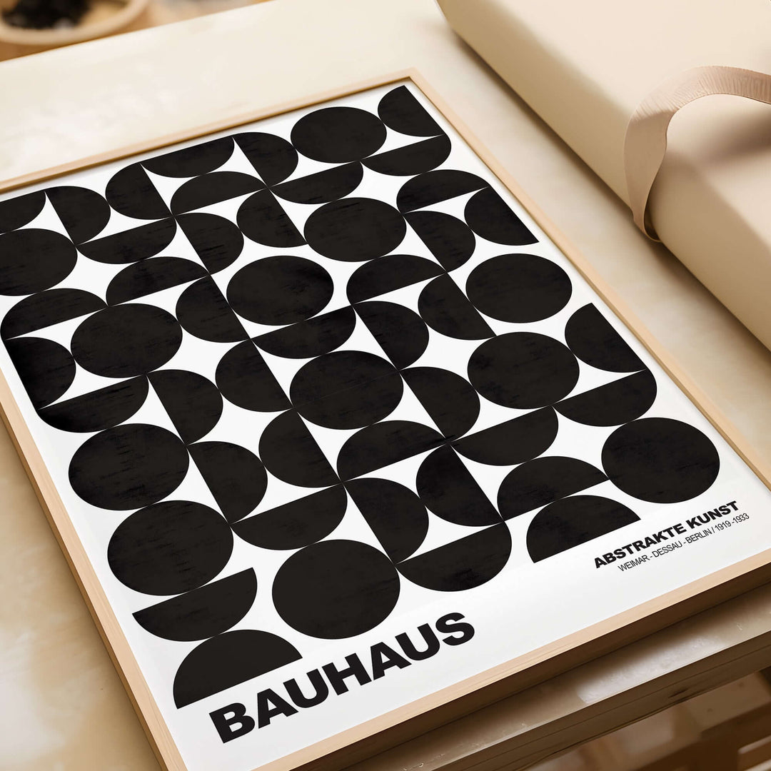 Bauhaus art print featuring black geometric circle shapes on a white background, showcasing modular design.
