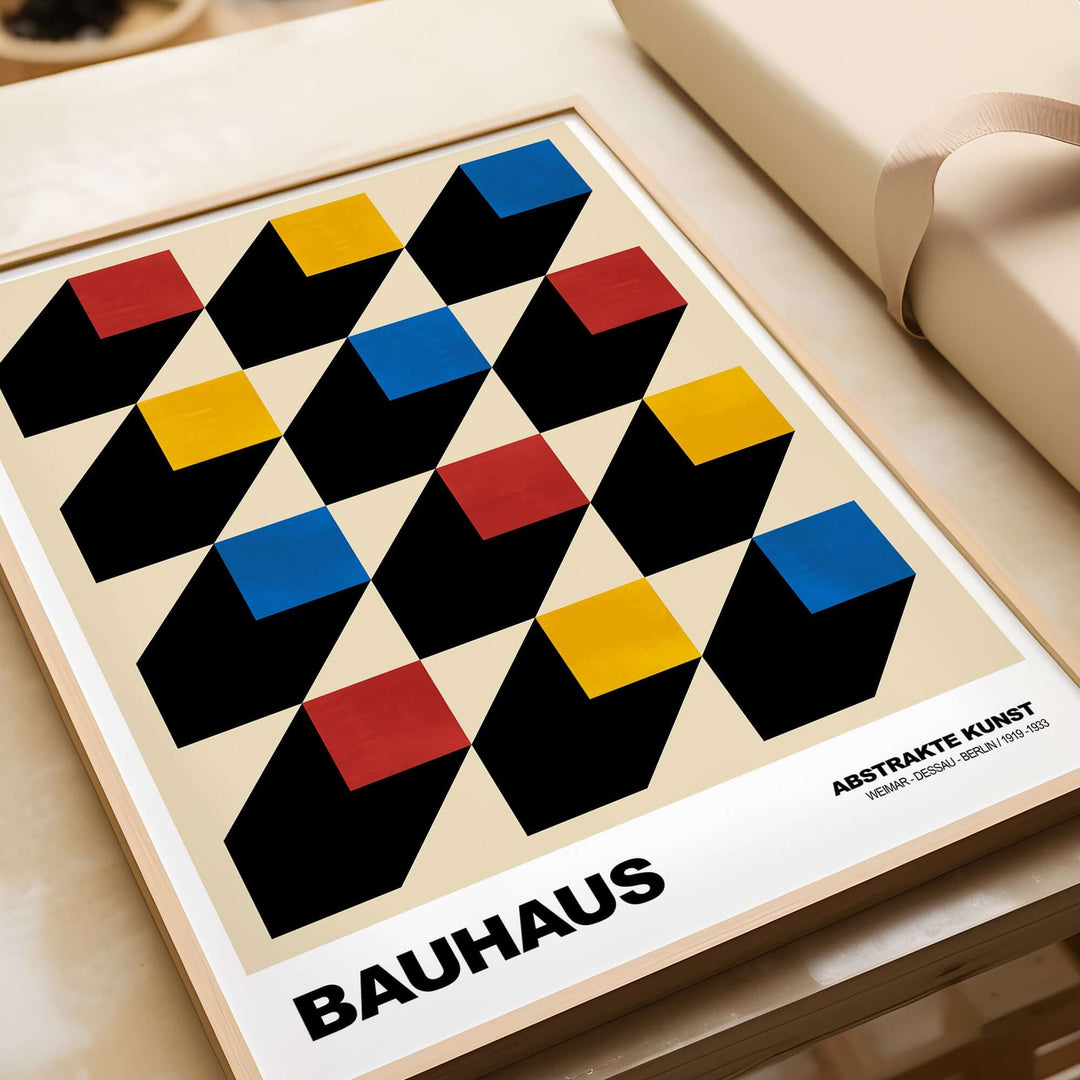 Bauhaus exhibition art print featuring isometric cubes in red, yellow, blue on a cream background.