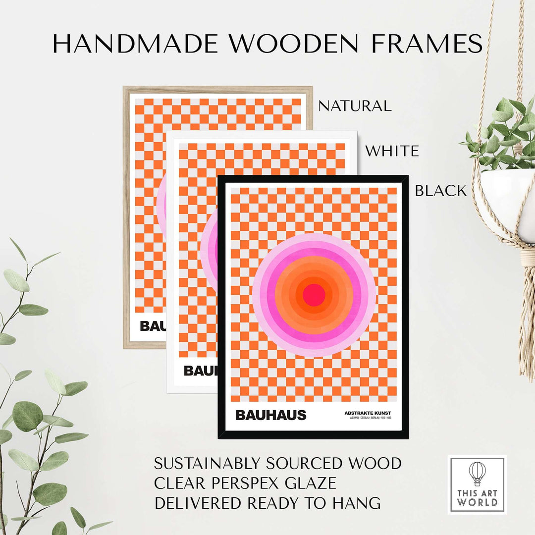 Handmade wooden frames in natural, white, and black for Bauhaus style poster with pink circles and orange checkerboard.