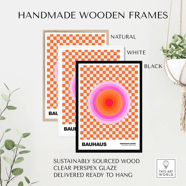 Handmade wooden frames in natural, white, and black for Bauhaus style poster with pink circles and orange checkerboard.