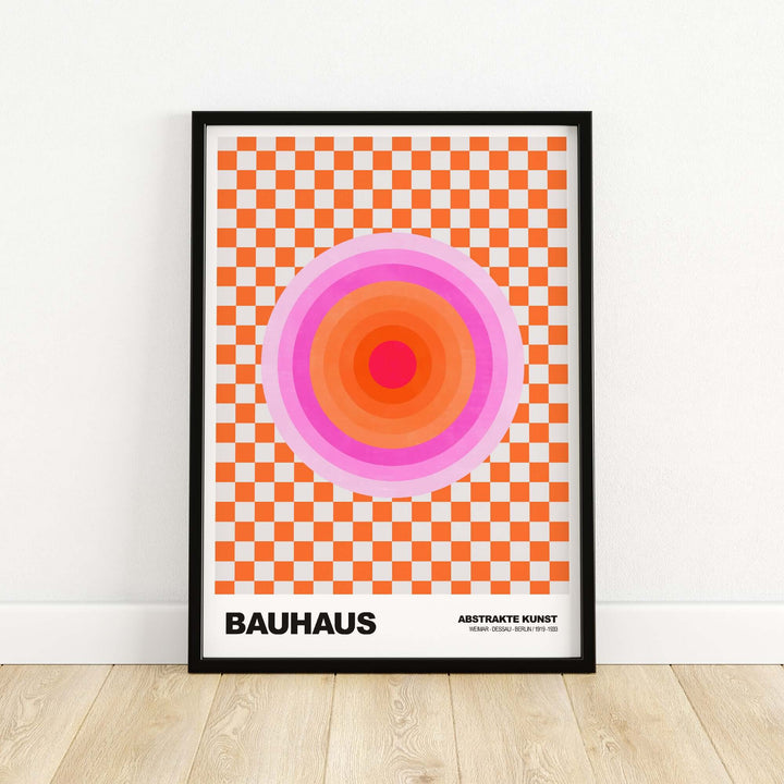 Bauhaus exhibition print featuring pink circles and orange checkerboard pattern in a modern art style.