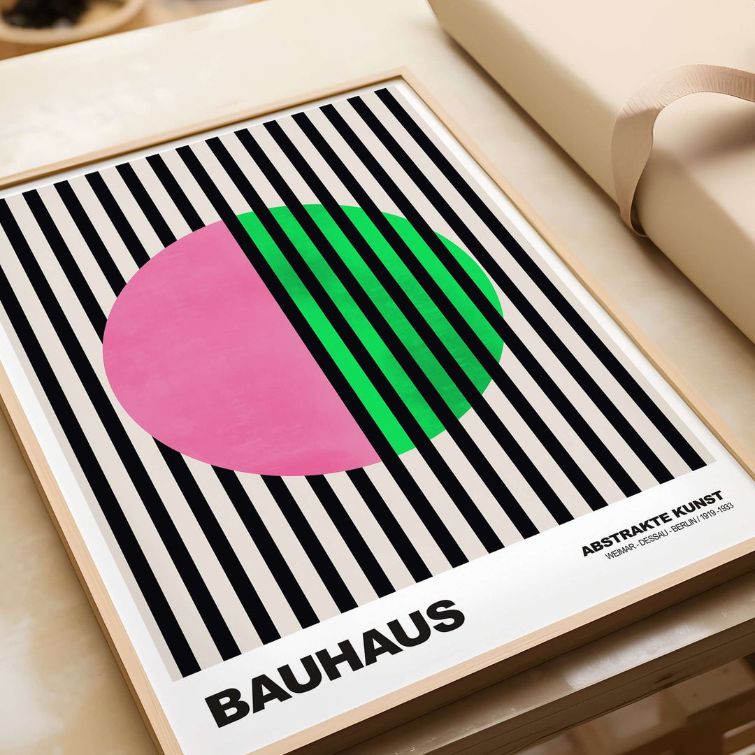 Bauhaus abstract art print featuring pink circle and green stripes against a black and cream striped background.