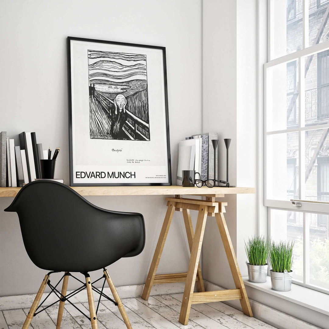 Edvard Munch The Scream lithograph art print on a stylish desk in a modern interior.