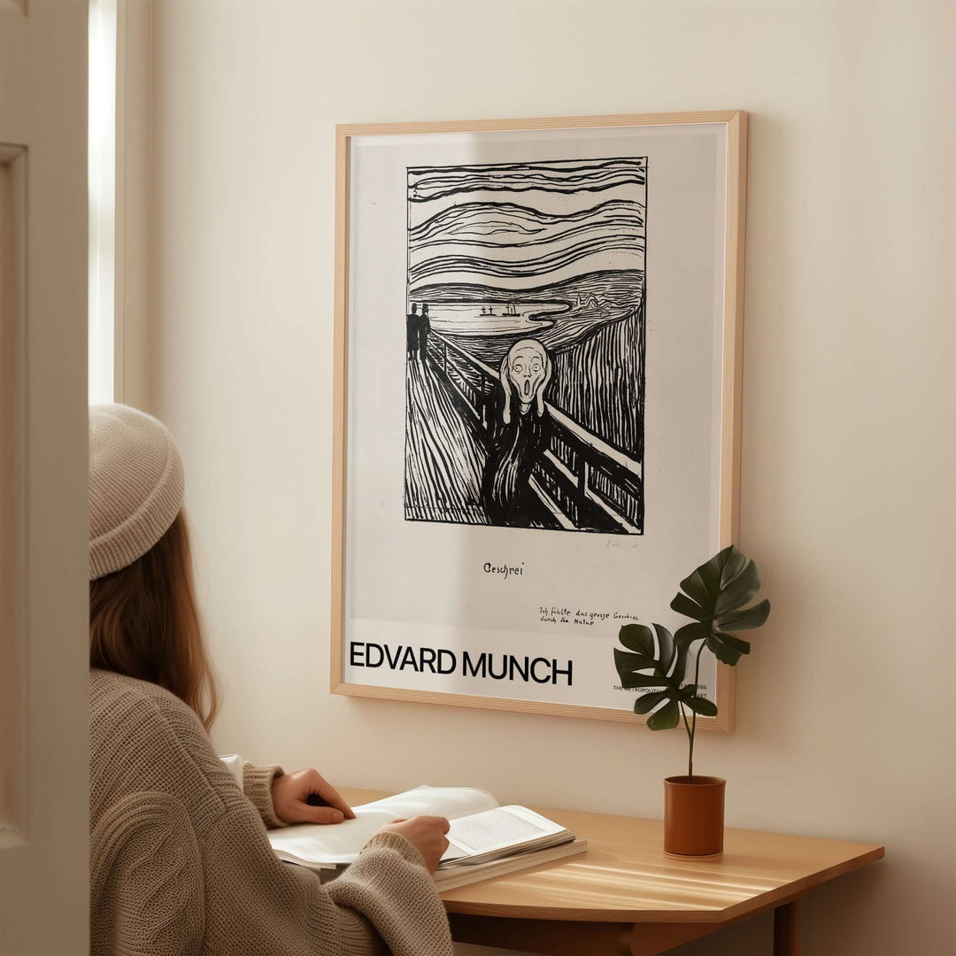 Edvard Munch The Scream 1895 lithograph art print framed on wall, with a person observing it in a cozy setting.
