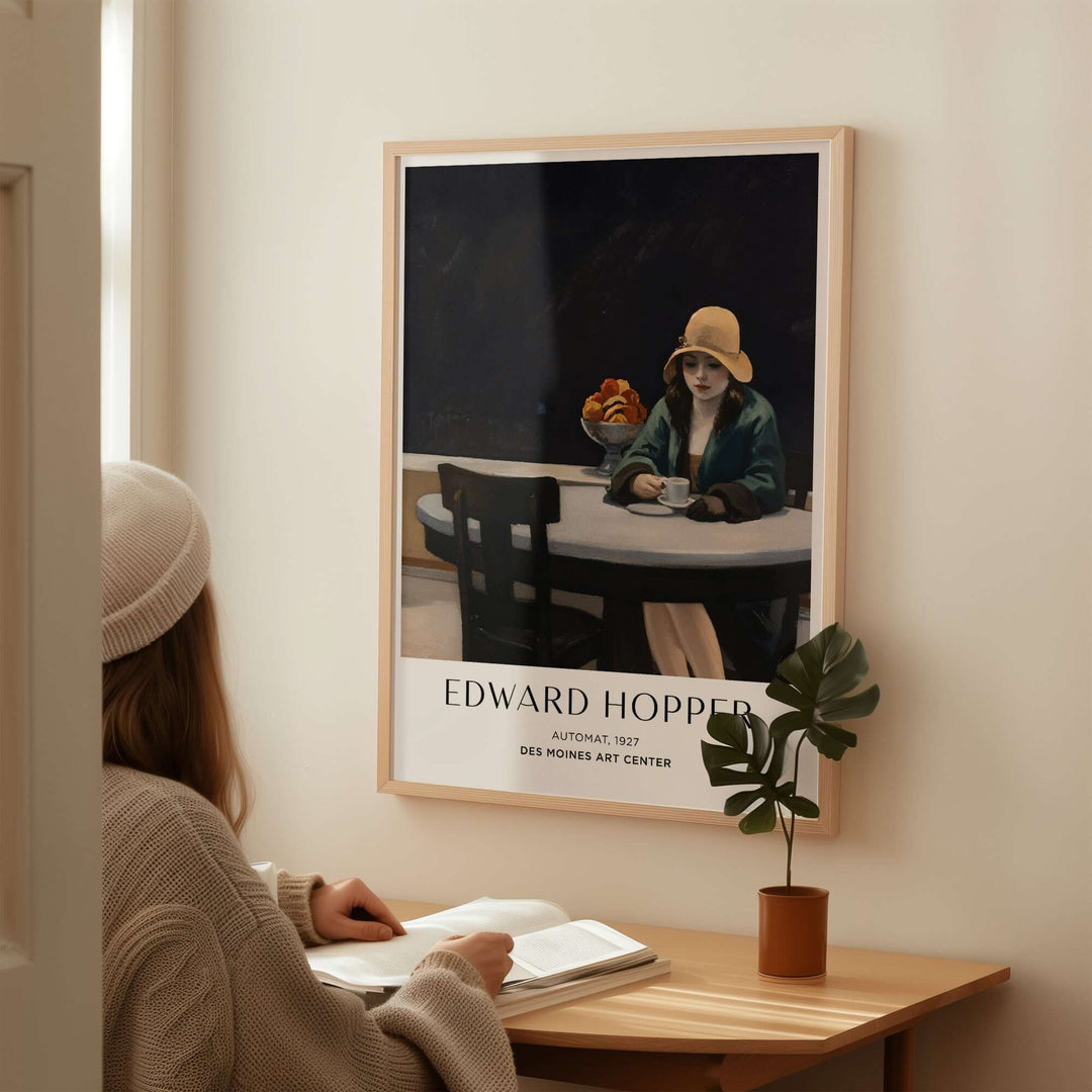 Edward Hopper Automat 1927 art print displayed in a cozy setting, featuring a woman and a potted plant.