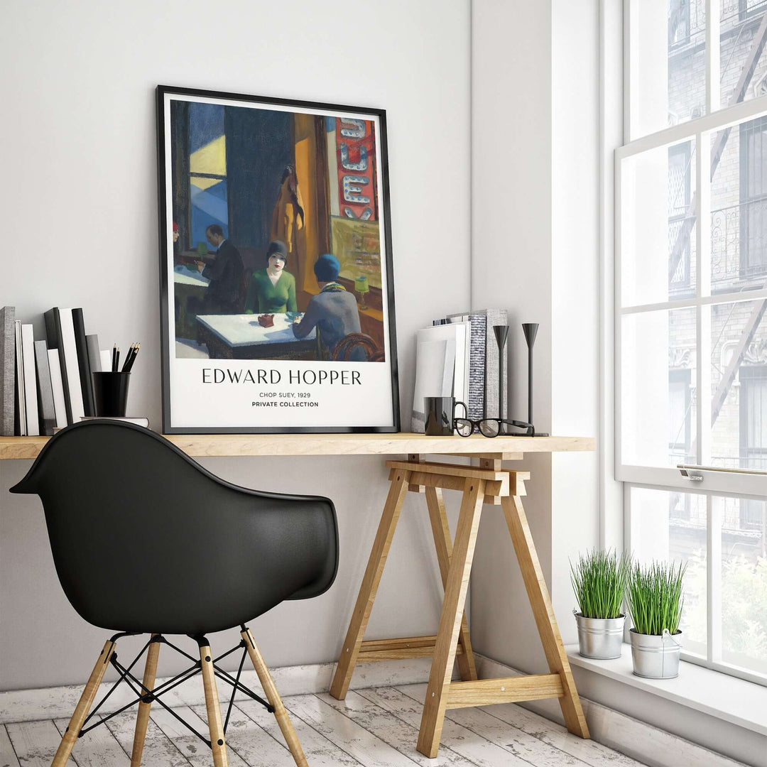 Edward Hopper Chop Suey 1929 art print poster displayed in a modern workspace, showcasing classic urban scene.