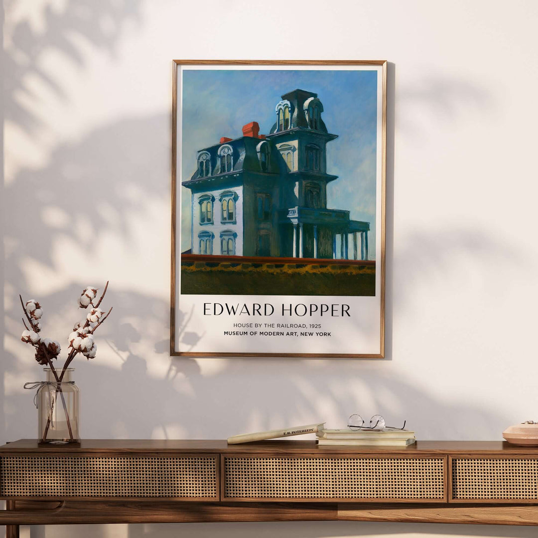 Edward Hopper House by the Railroad 1925 art print poster displayed on a wall showcasing iconic American art.