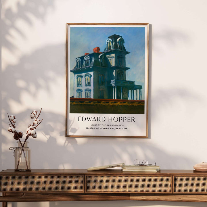 Edward Hopper House by the Railroad 1925 art print poster displayed on a wall showcasing iconic American art.