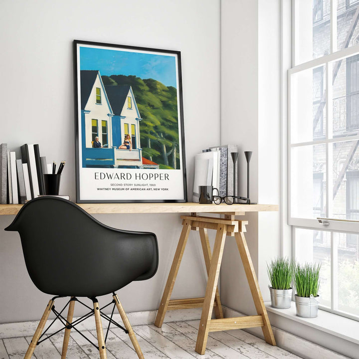 Edward Hopper Second Story Sunlight print displayed on desk in modern interior with natural light.