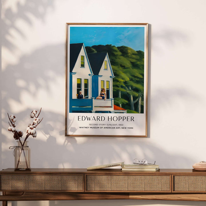 Edward Hopper Second Story Sunlight 1960 art print displayed on a stylish wall above a wooden console table.