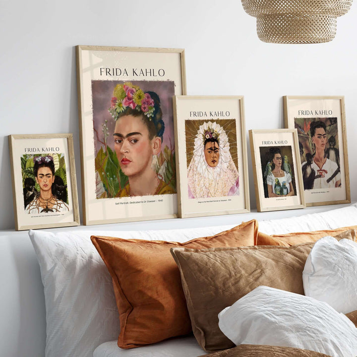 Frida Kahlo art prints displayed on a shelf, showcasing her iconic self-portraits in elegant frames.
