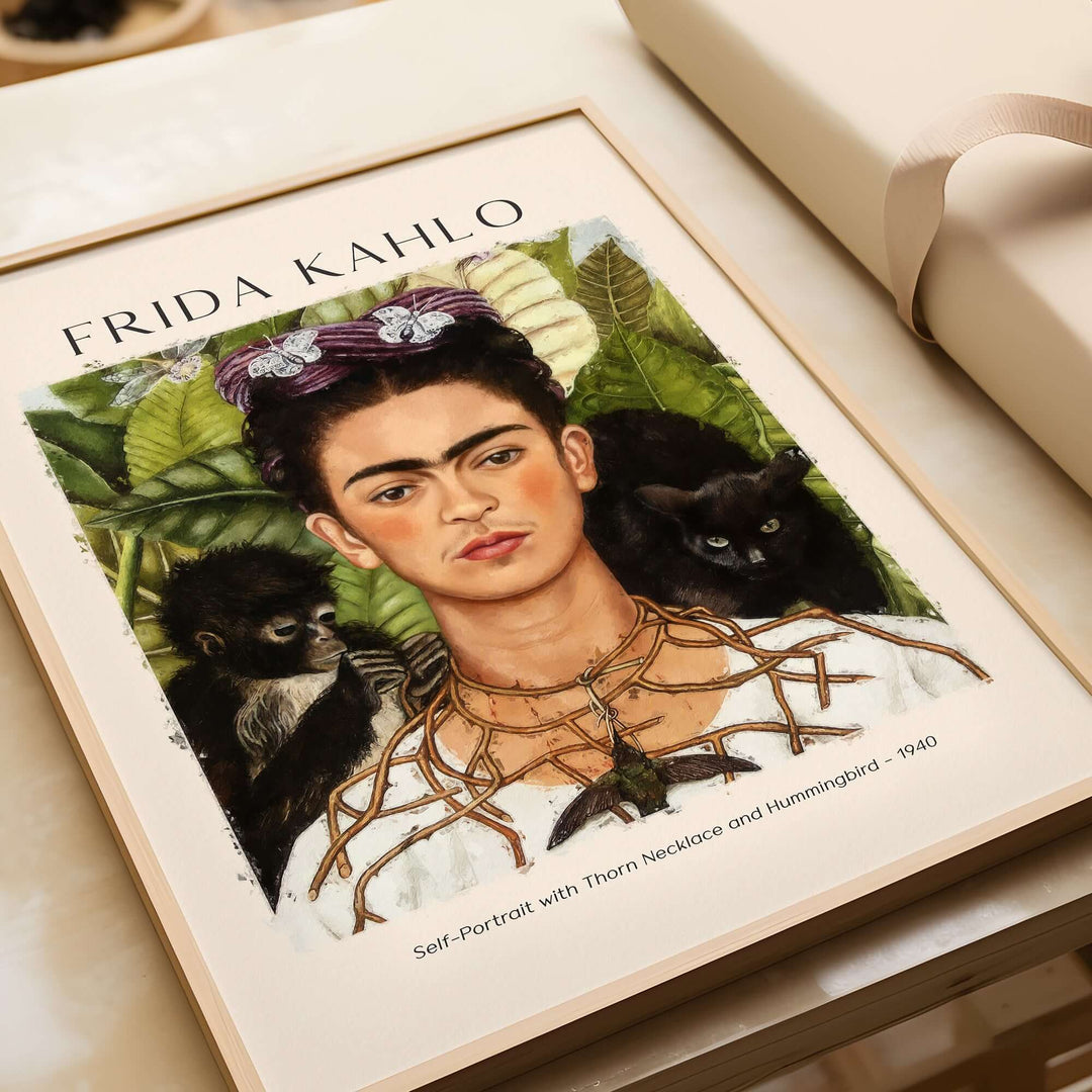 Frida Kahlo Self-Portrait with Thorn Necklace and Hummingbird art print showcasing her intense gaze and symbolic animals.