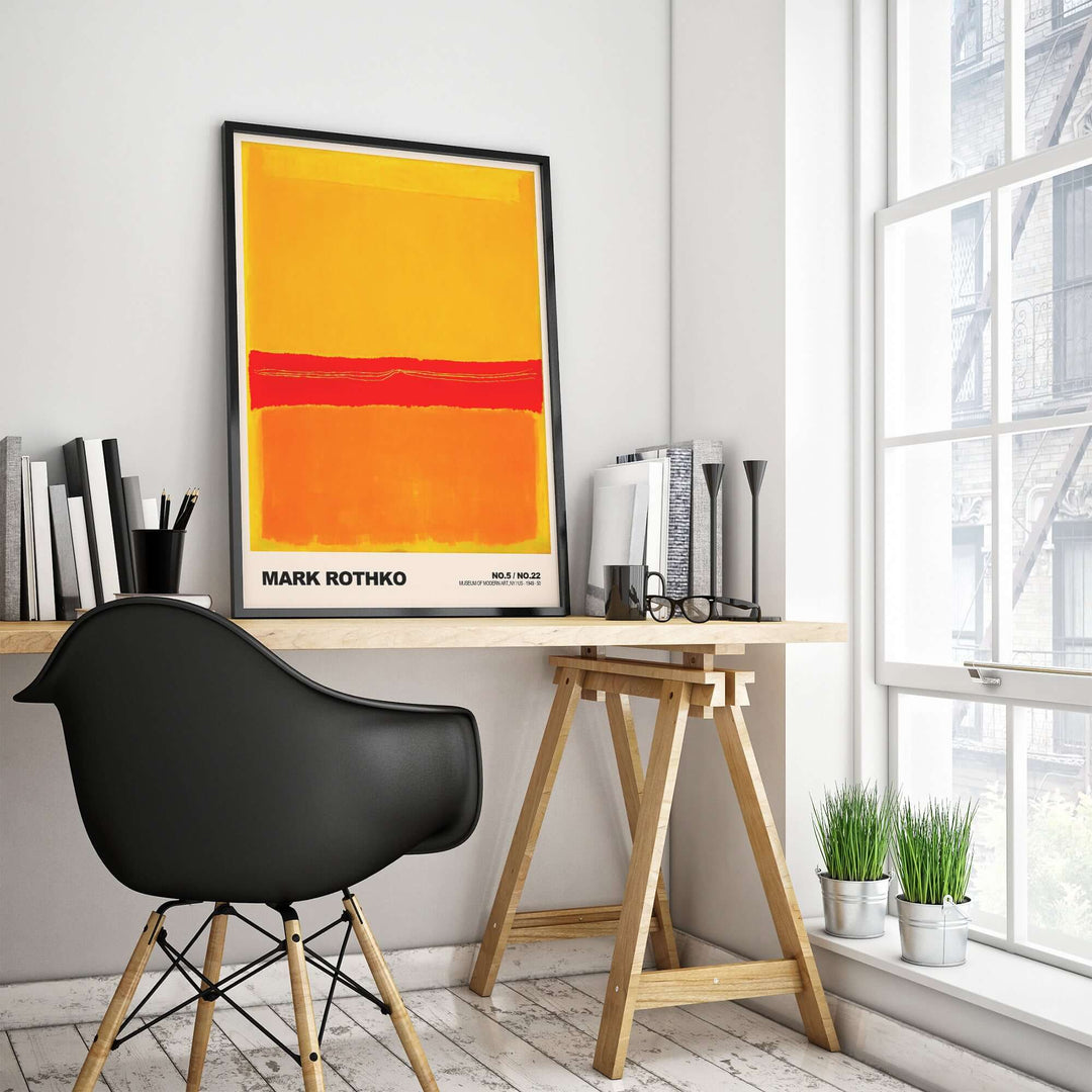 Mark Rothko No 5 No 22 abstract expressionist print in modern workspace with black chair and plants.