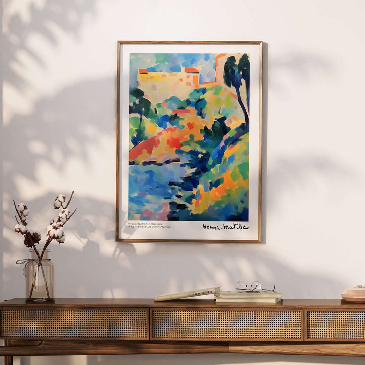 Matisse art print featuring an abstract coastal landscape in vibrant colors displayed on a wall above a stylish console table.