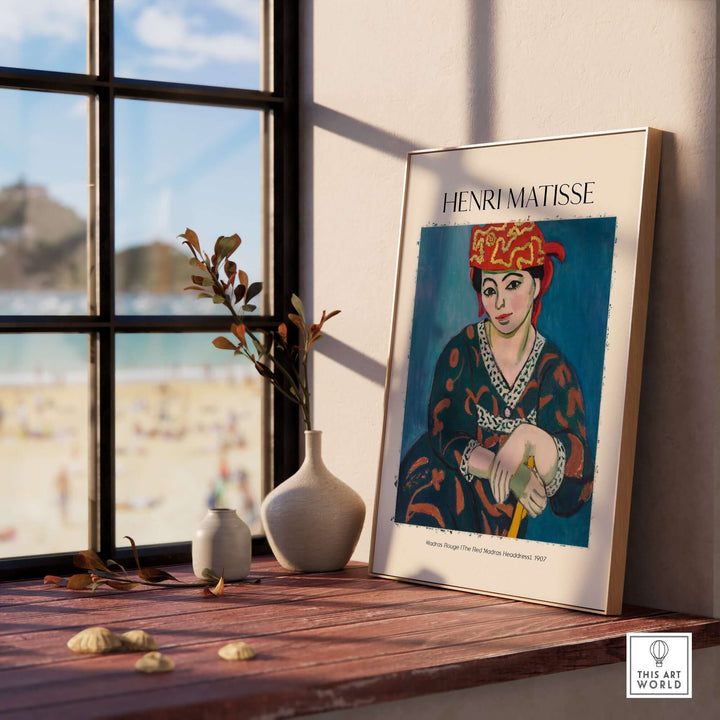 Henri Matisse Madras Rouge Red Headdress 1907 art print displayed indoors, showcasing vibrant colors and a beach view.