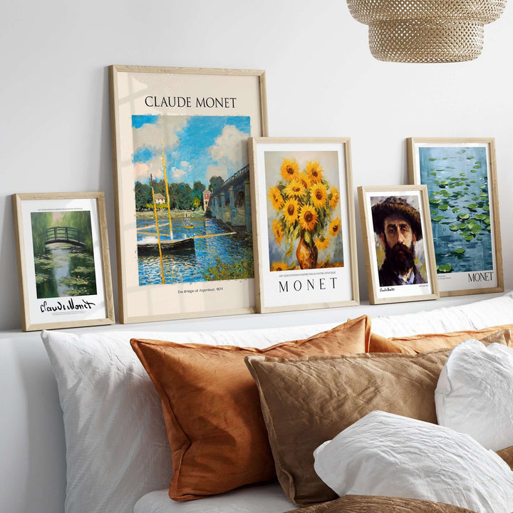 Gallery of framed Claude Monet art prints featuring landscapes and sunflowers, displayed above a cozy sofa.