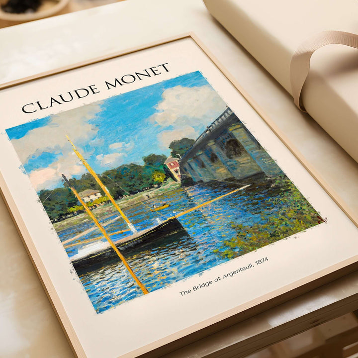 Monet 'The Bridge at Argenteuil' art print featuring a bright summer landscape with boats on the Seine River.