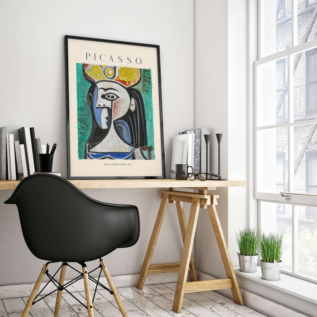 Colorful Picasso art print 'Bust of Seated Woman' (1962) displayed in modern office setting.