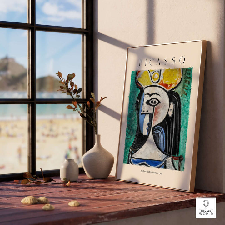 Picasso Bust of Seated Woman 1962 art print framed in a stylish setting with beach view and decorative elements.