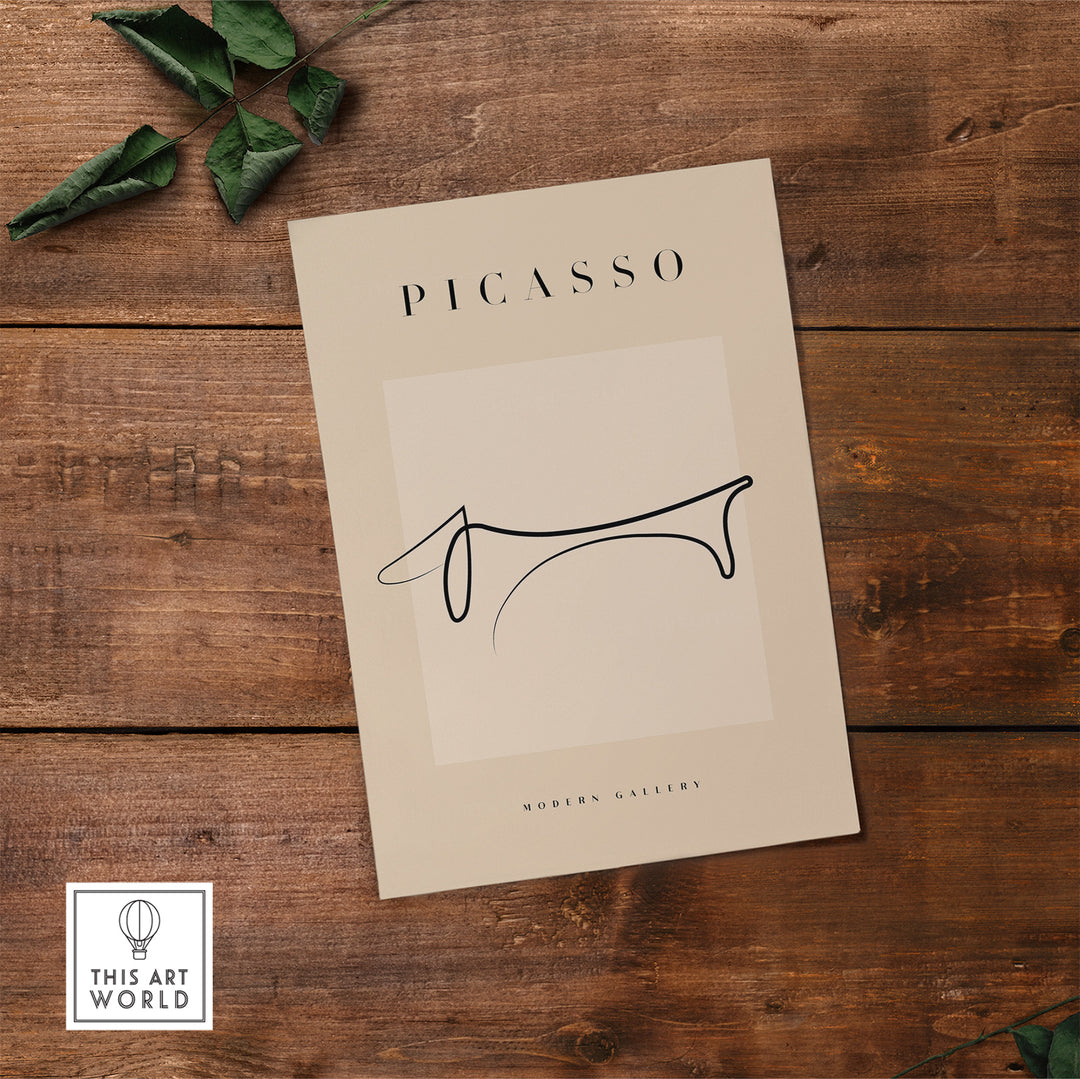 Minimalist Picasso Dachshund line art poster displayed on wooden surface, showcasing elegant simplicity.