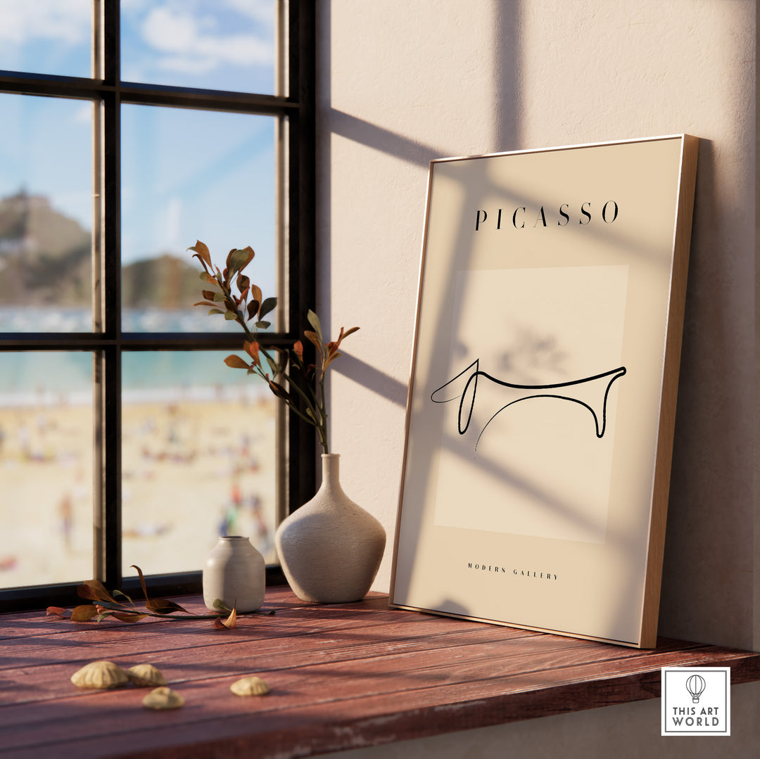 Picasso Dachshund line art poster displayed on a windowsill, featuring minimalist design in modern gallery style.