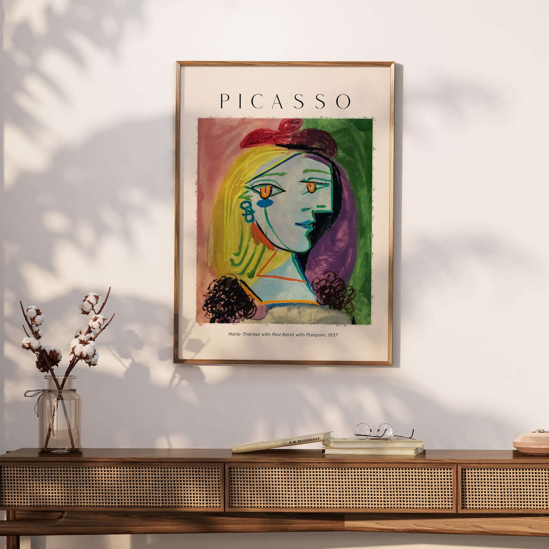 Picasso 1937 portrait art print of Marie-Thérèse with red beret, colorful Cubist design on wall.