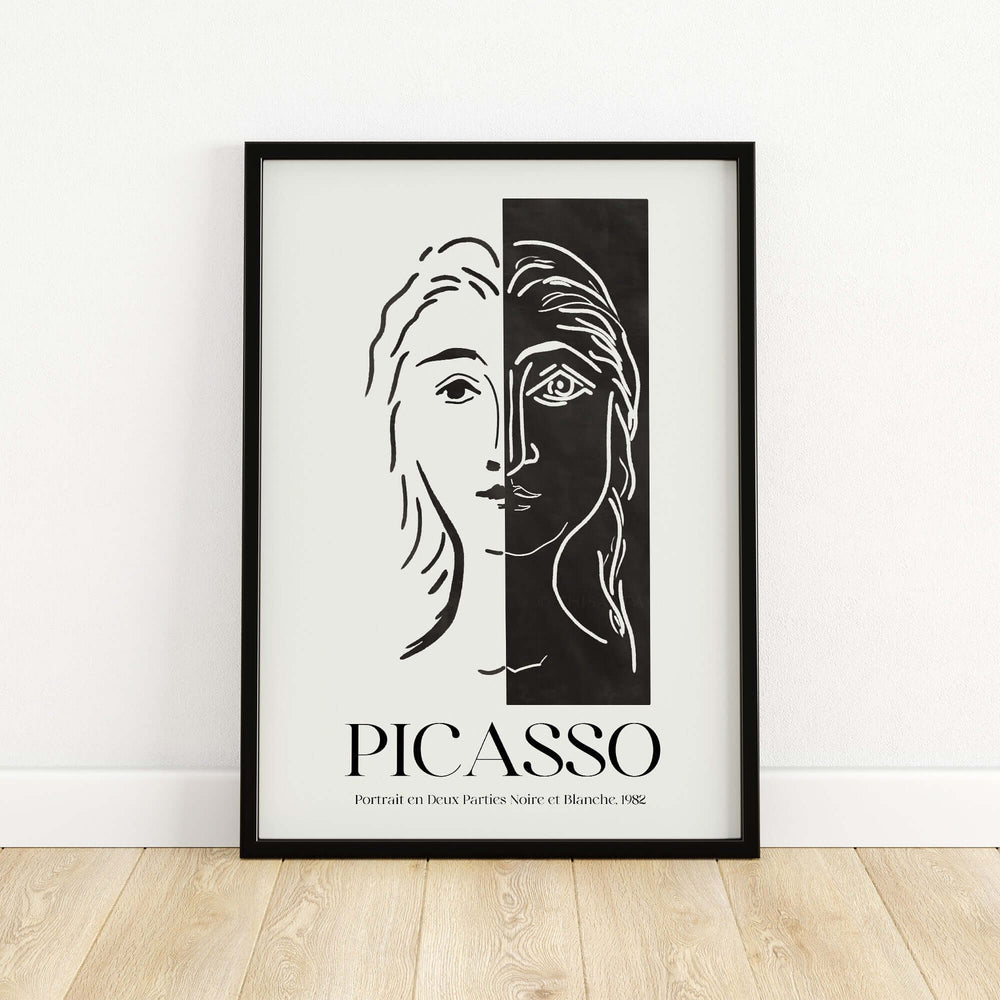 Black and white Picasso art print featuring a split face design, showcasing minimalist abstract style and modern duality.